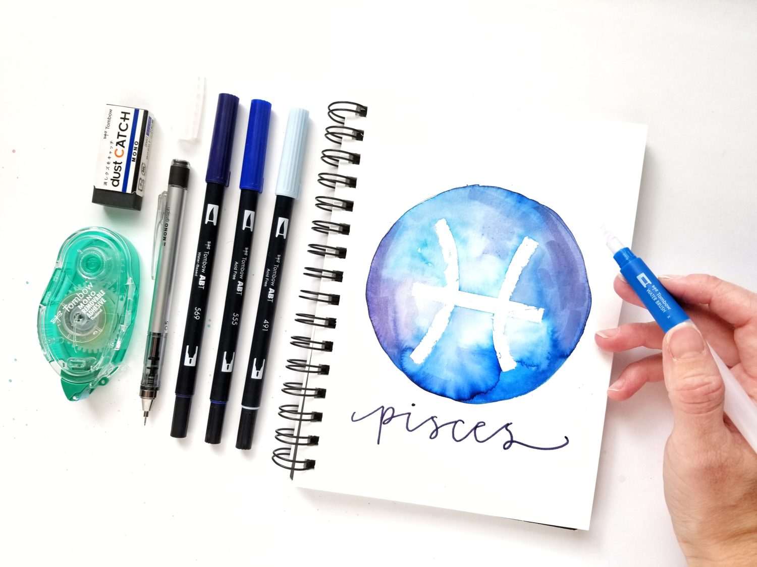 Create easy zodiac watercolor masking art using @tombowusa Dual Brush Pens and MONO Removable Adhesive with @graceannestudio!