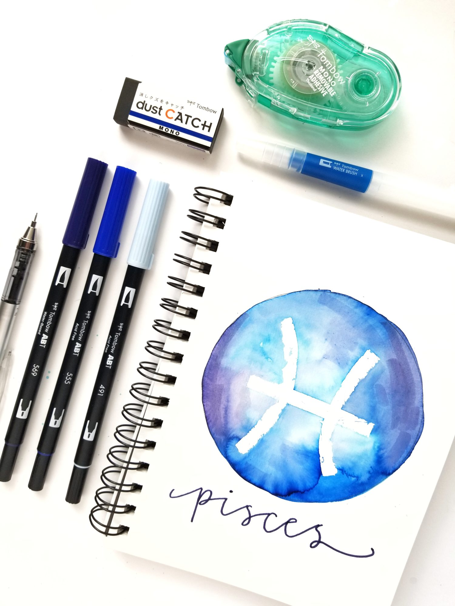 Create easy zodiac watercolor masking art using @tombowusa Dual Brush Pens and MONO Removable Adhesive with @graceannestudio!