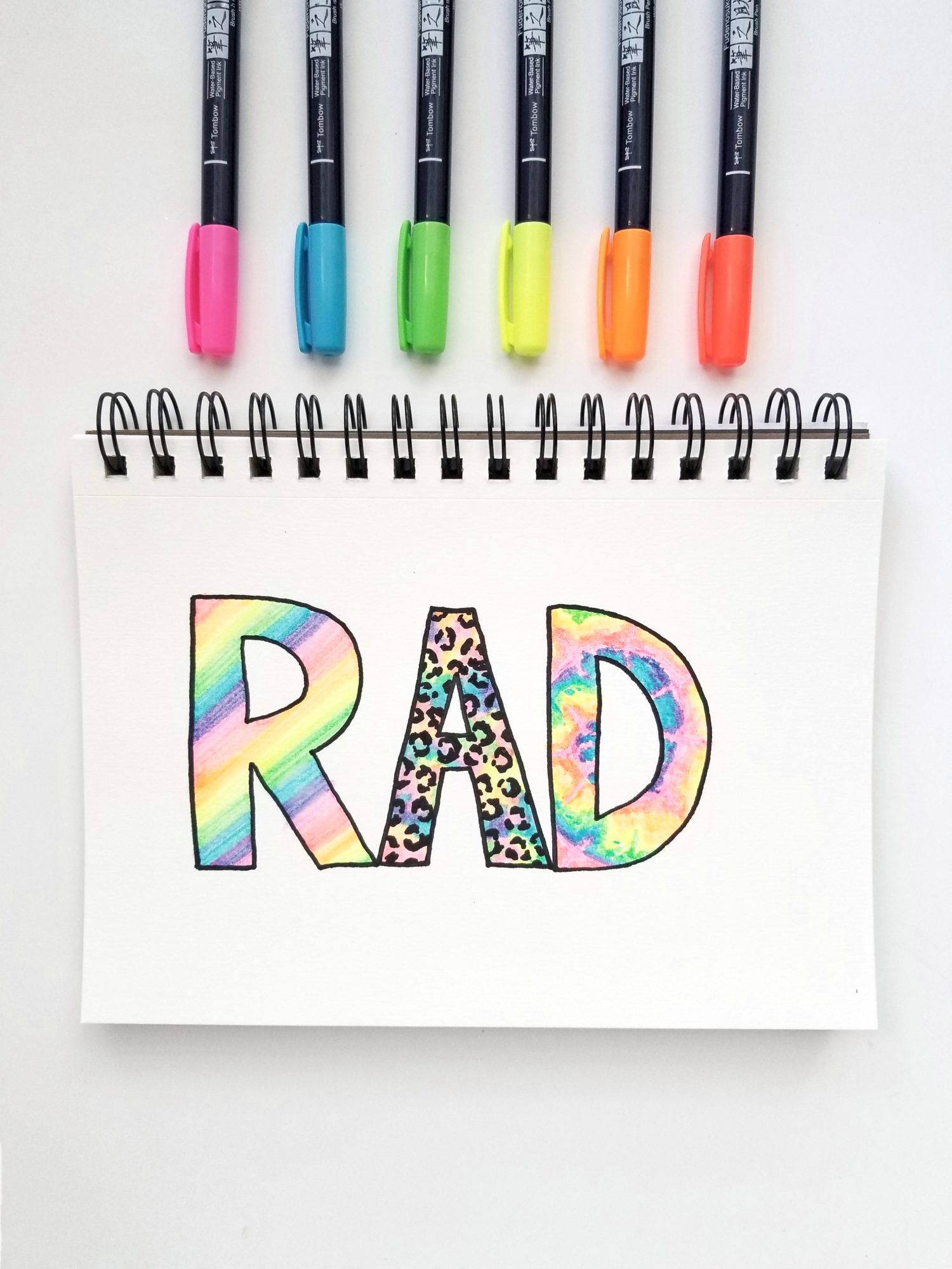 Learn 3 Lettering Fill Styles using @tombowusa Neon Fudenosuke Brush Pens with @graceannestudio!