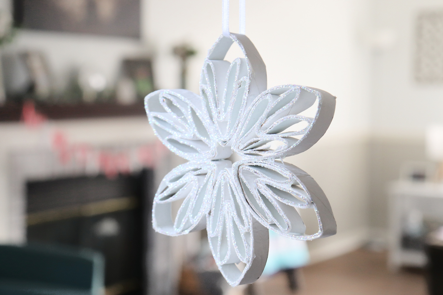 Learn to make a Paper Roll Snowflake with the help of Tombow adhesives in this tutorial by Amy Latta.