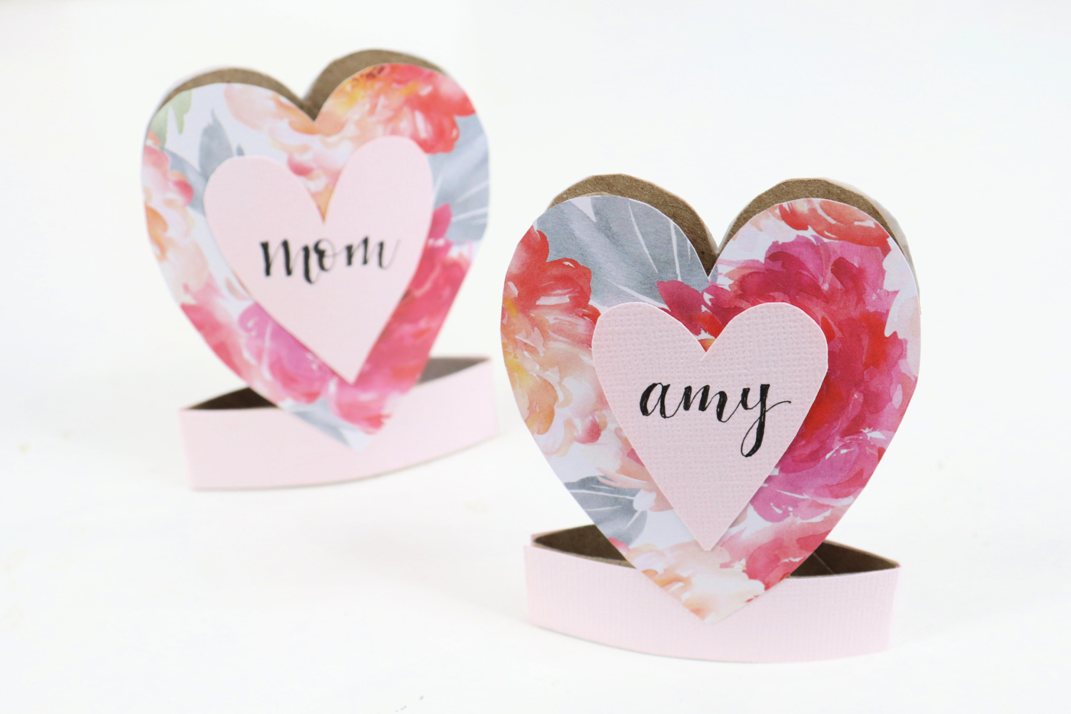 Image contains two finished Valentine paper roll projects on a white background.