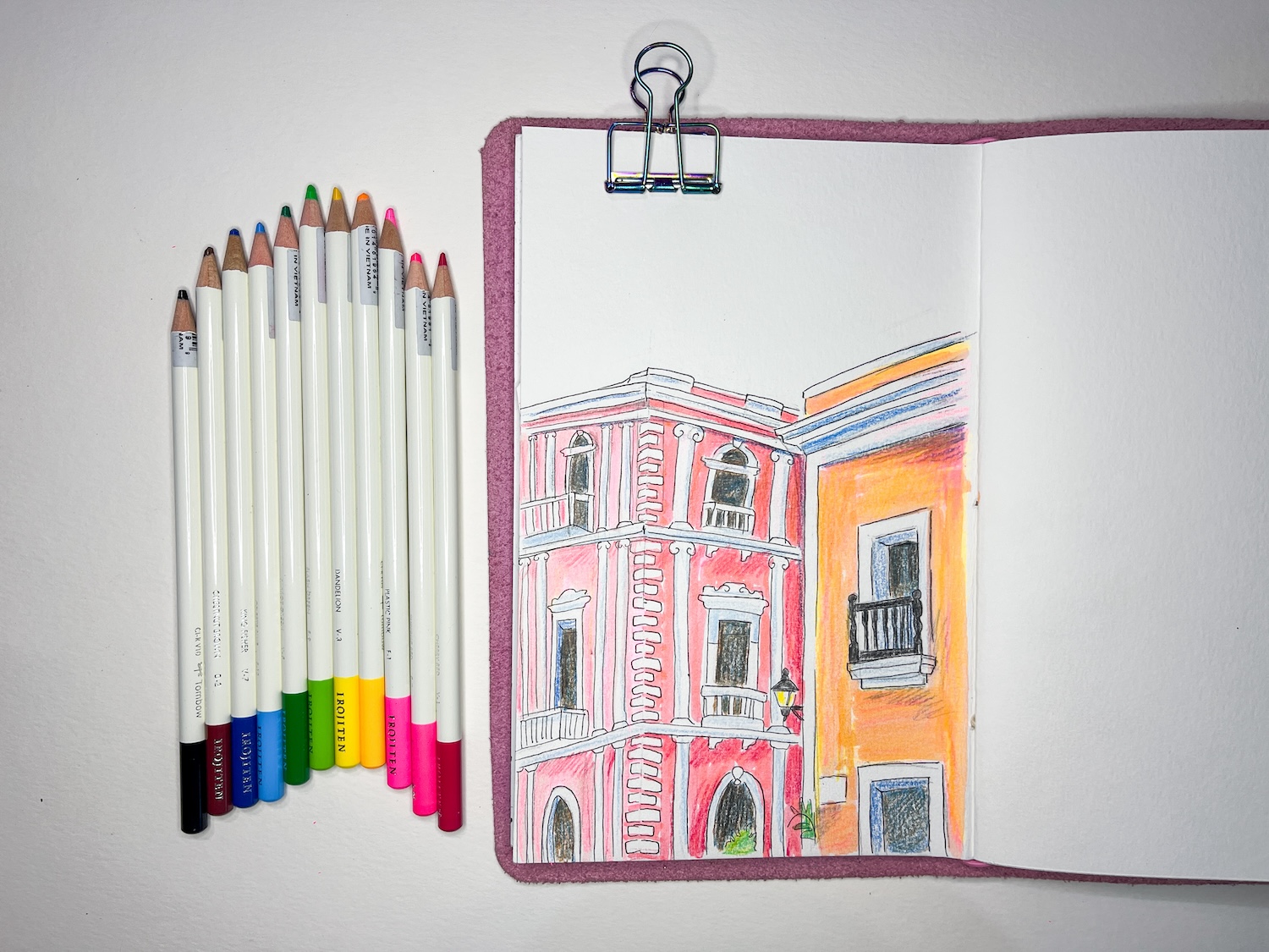 a travel journal laying next to @tombowusa Irojiten Colored Pencils Vivid 12-Pack