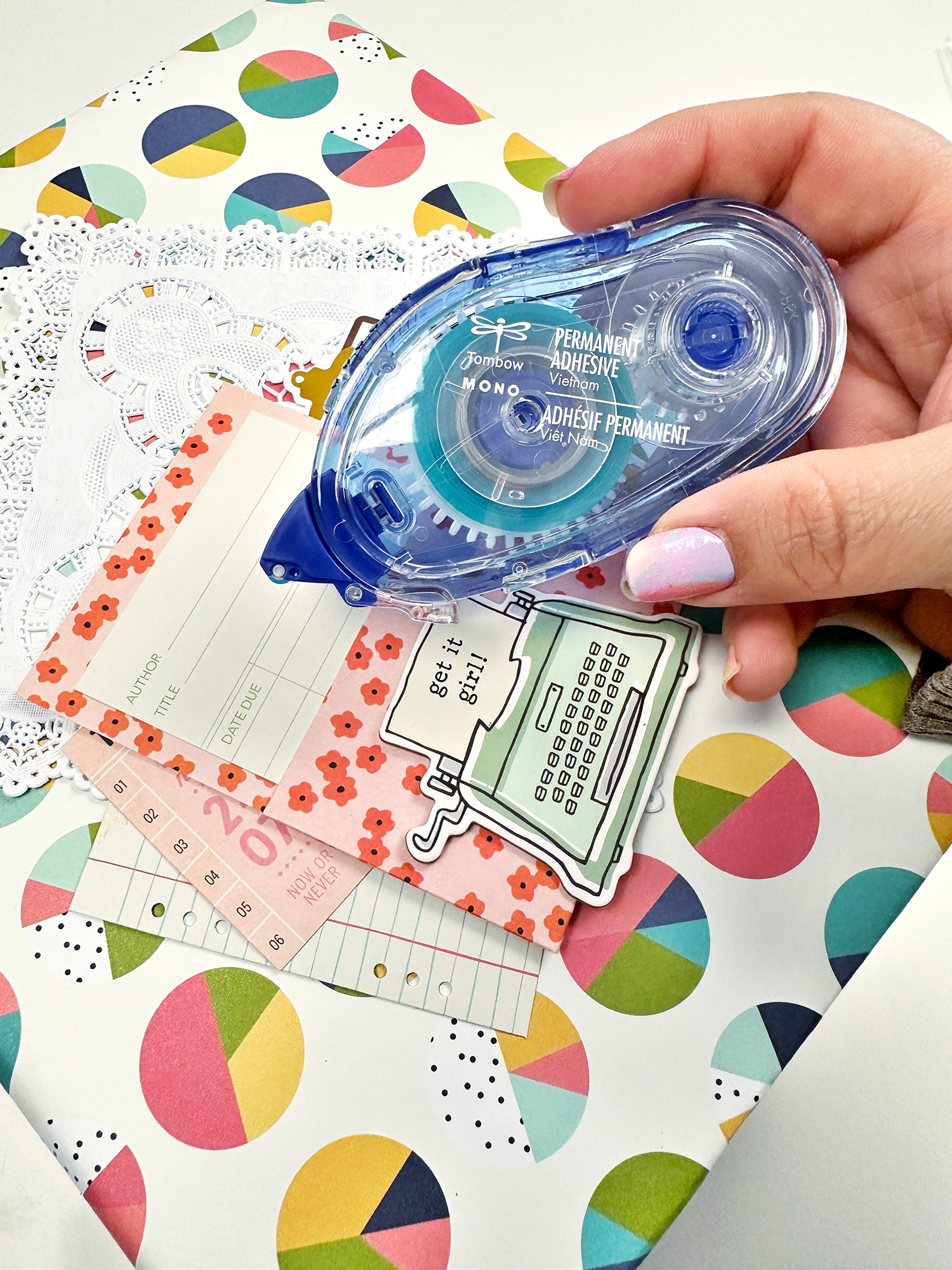 Use the Tombow MONO Adhesive Permanent to glue embellishments on the book cover. Layer embellishments of different textures and sizes to create an interesting cluster! #tombow #diy