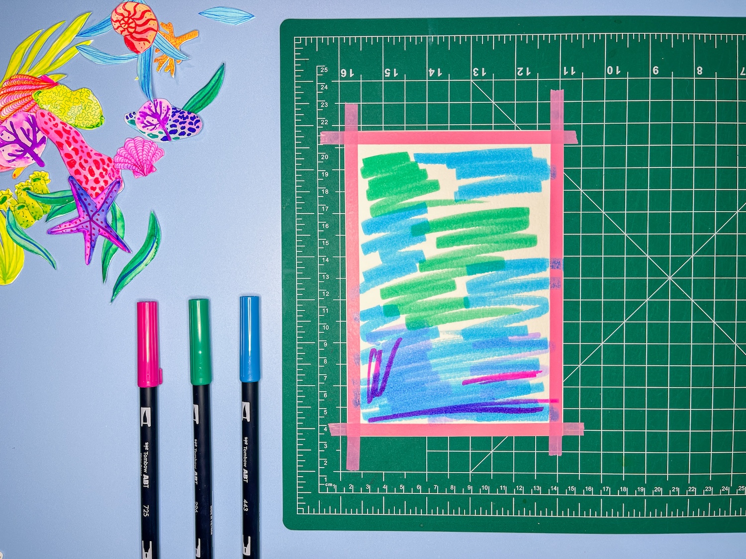 Use washi tape to tape off a border of your watercolor paper and apply @tombowusa Dual Brush Pens to the paper