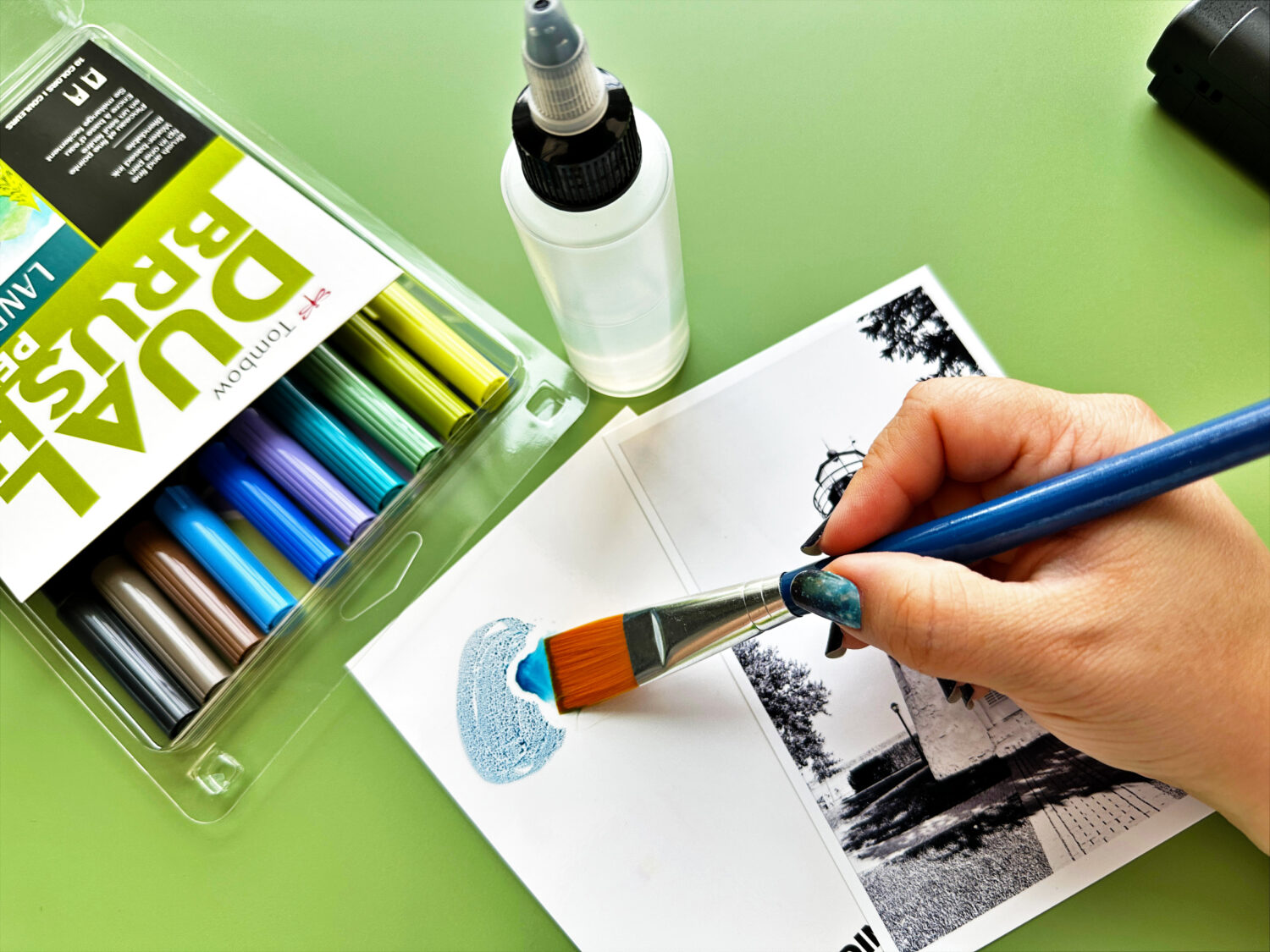 To color this photo, I used the Tombow Dual Brush Pens Landscape Pack. Start with the sky. Scribble with the Tombow Dual Brush Pens on the Blending Palette. Add a drop of water and pick up color. #tombow #postcard