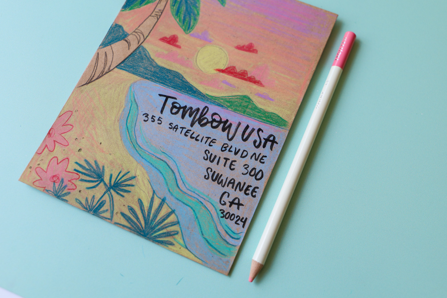 Try drawing a landscape on your envelope, leaving a space large enough for your address
