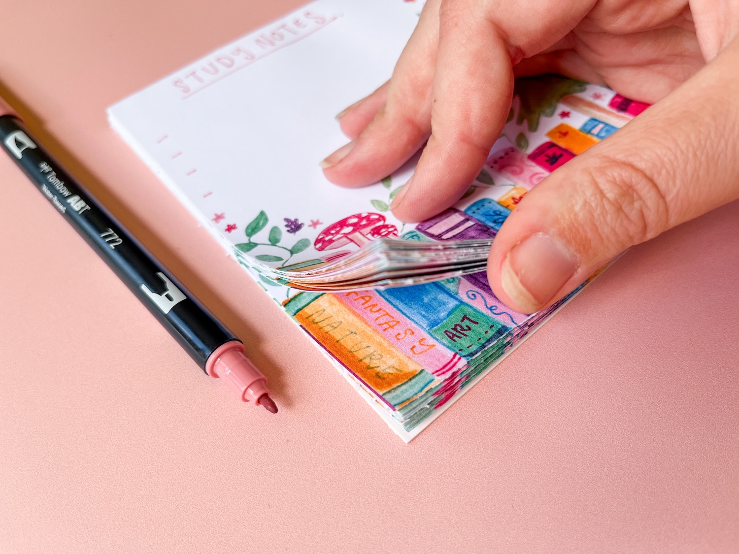Learn how to make a DIY Notepad with a cute book theme using Tombow Dual Brush Pens and MONO Aqua Liquid Glue!
