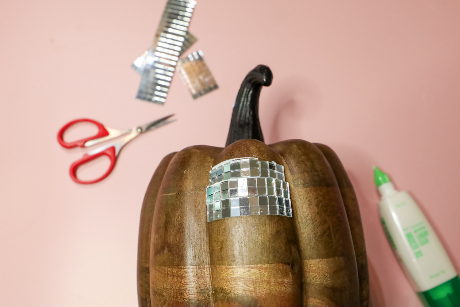 Adhere disco tiles to your faux pumpkin using @tombowusa MONO Multi Liquid Glue