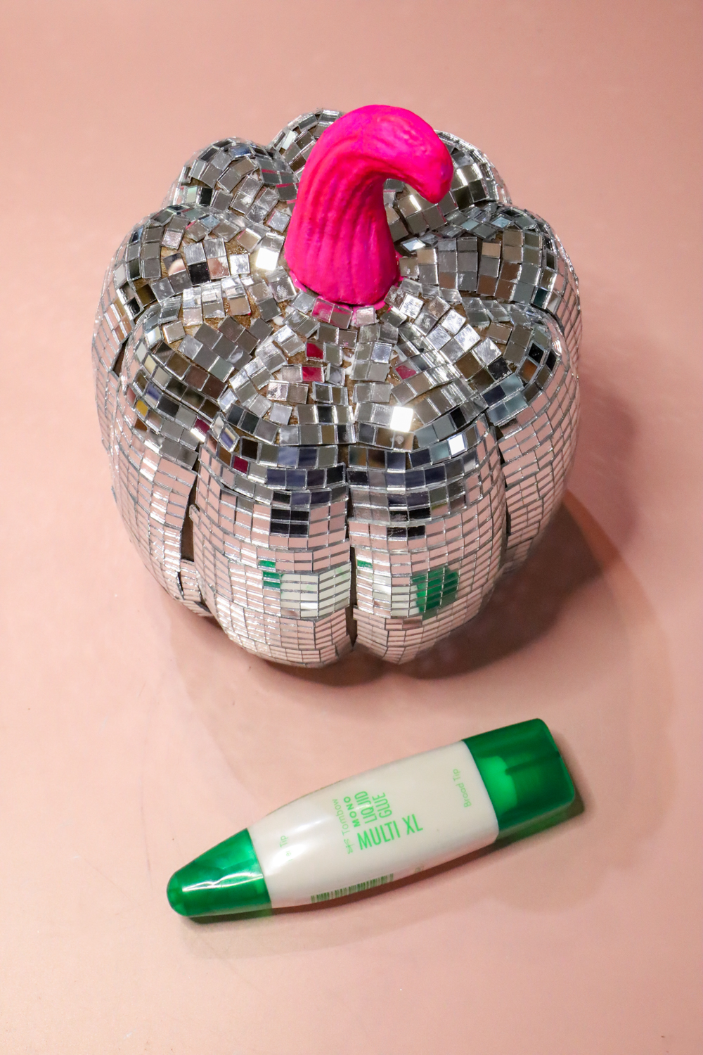 Learn how to make a Disco Ball Pumpkin following this tutorial on the @tombowusa blog!