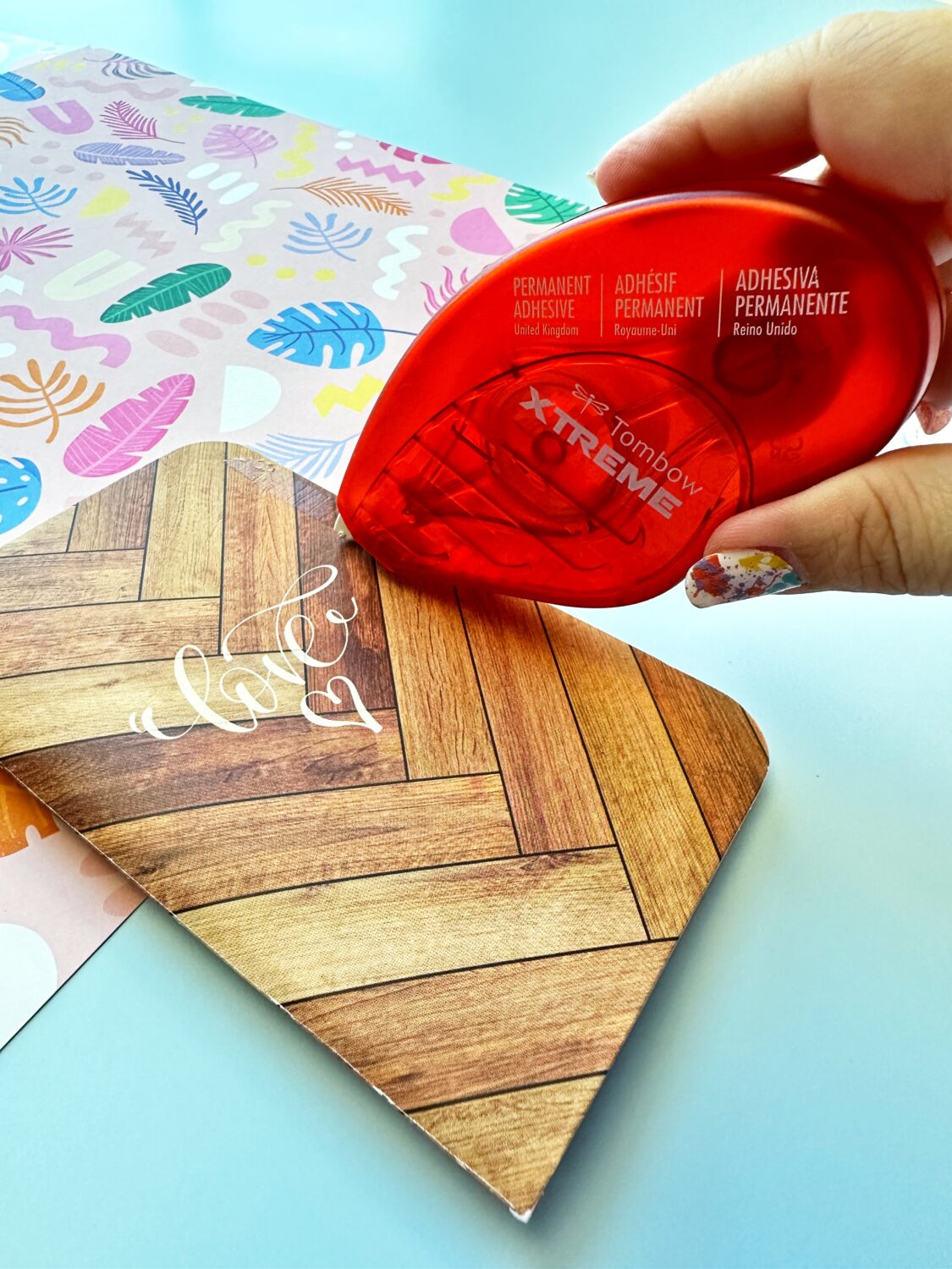 Use the Tombow Xtreme Adhesive on the cover of the notebook. The Tombow Xtreme Adhesive is stronger than the other adhesive runners. It's perfect for projects that will be handled more often. #tombow #papercrafts