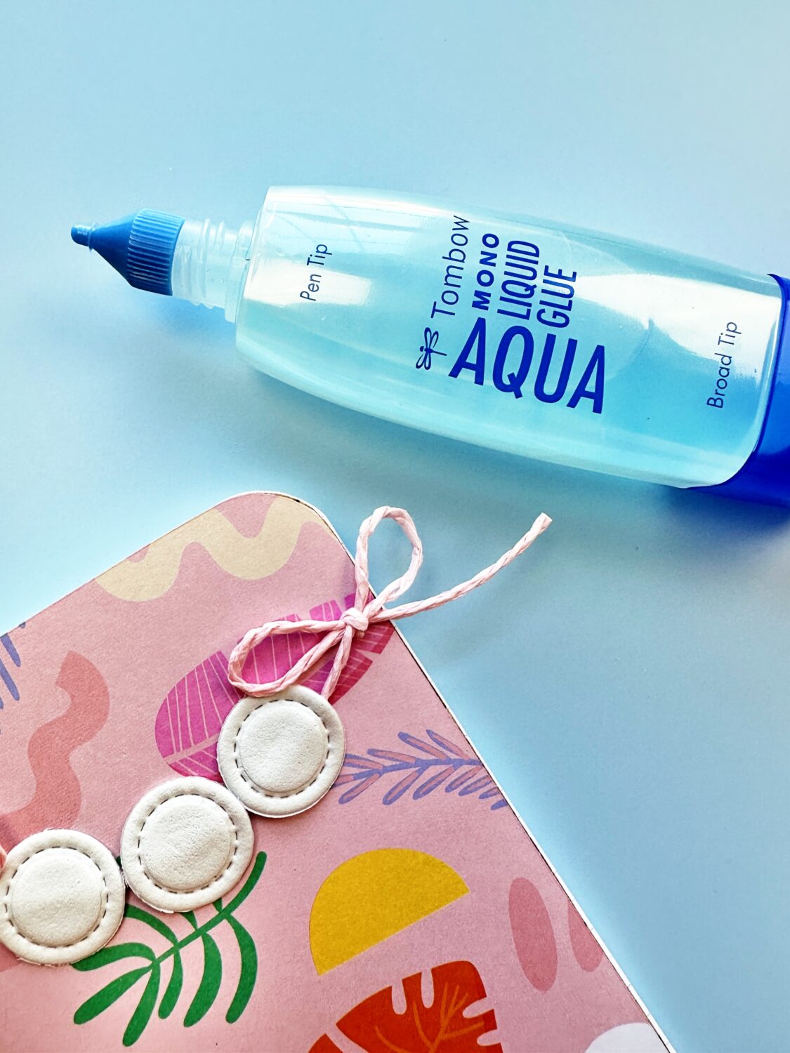 Use the Tombow MONO Aqua Liquid Glue to glue the twine. This glue dries clear so there is no residue. #tombow #papercrafts