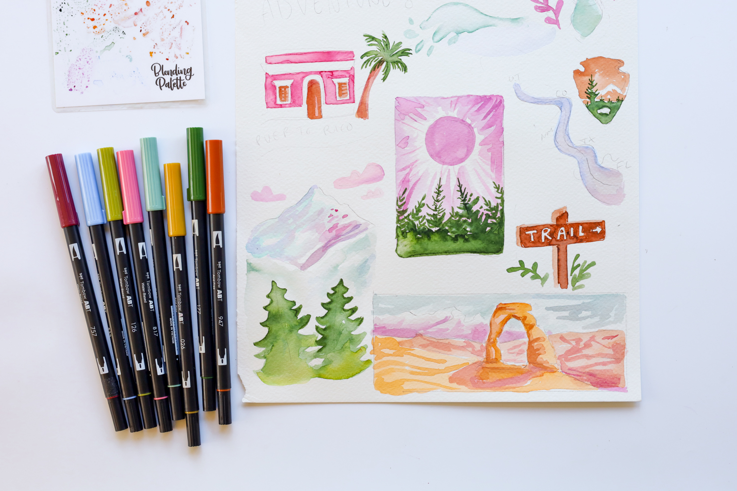 Tombow USA Dual Brush Pens laying next to my DIY Travel Memory Art. Get the tutorial at blog.tombowusa.com