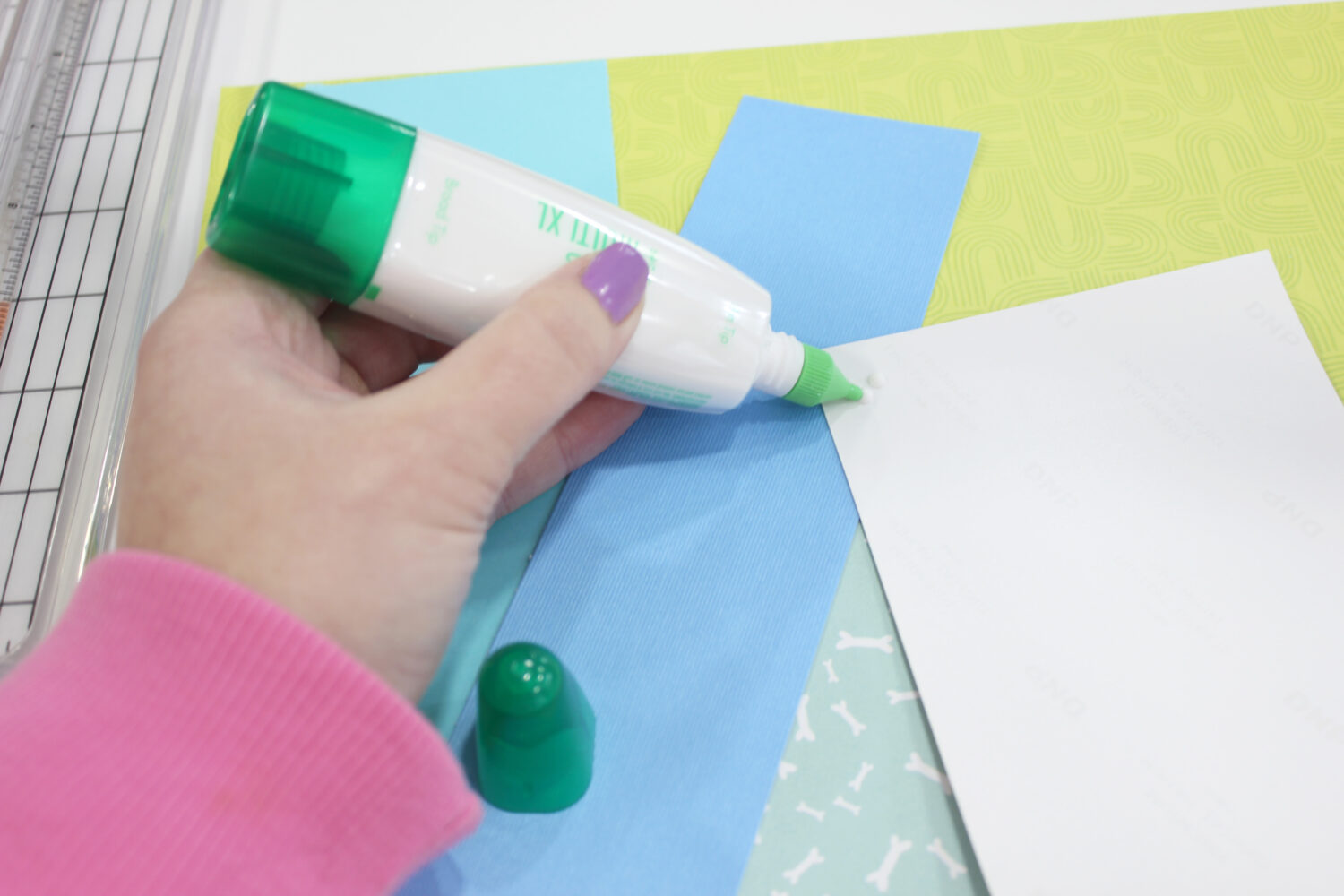 glue being applied to a photo