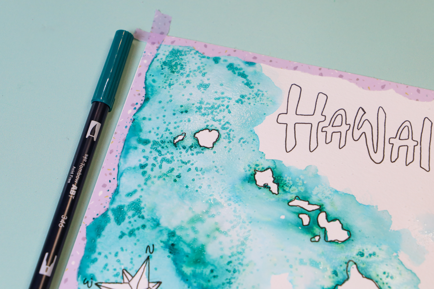 Using salt and @tombowusa Dual Brush Pen ink to create an ocean effect for a DIY Hawaiian Island Map