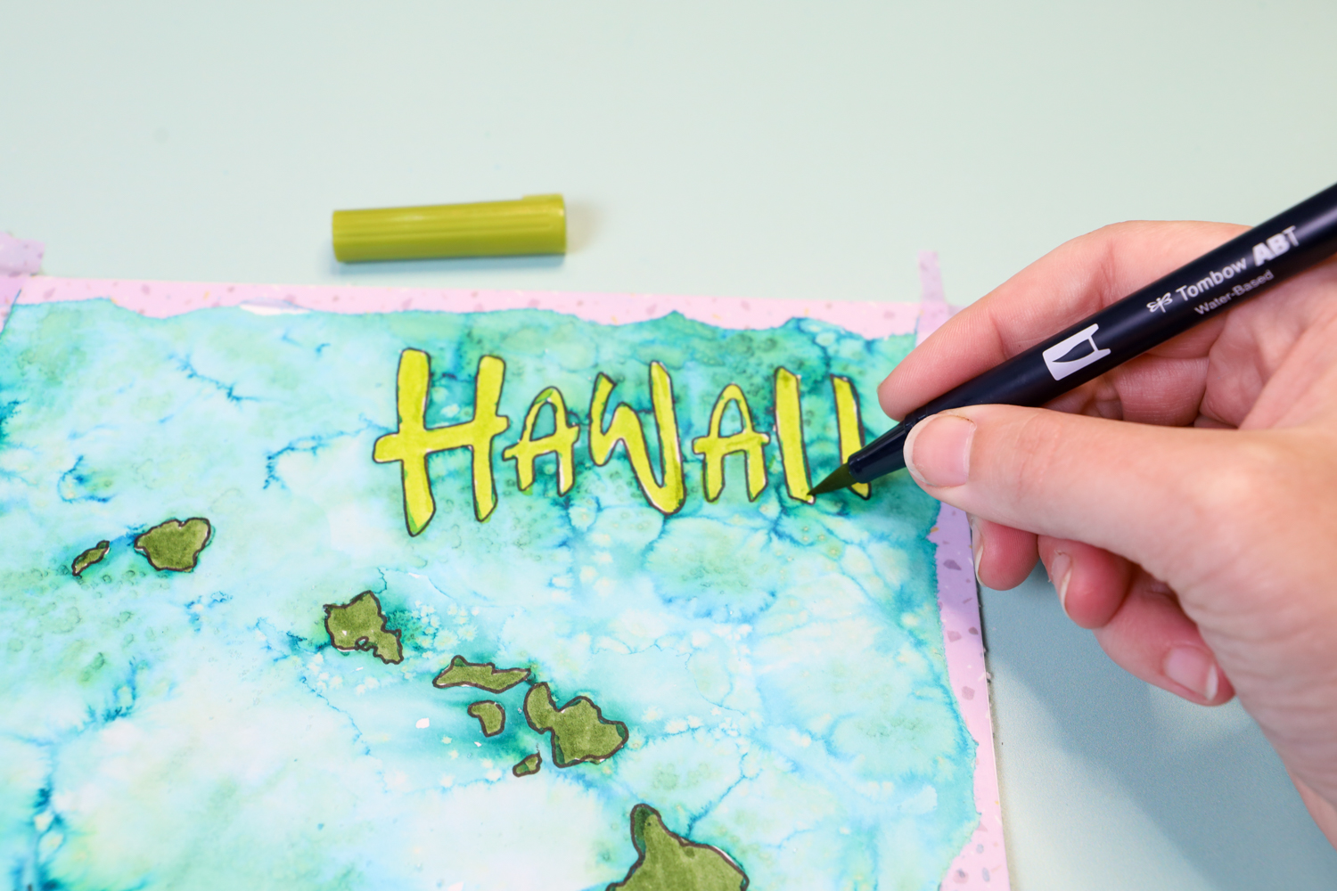 Coloring in the word "Hawaii" with a @tombowusa Dual Brush Pen