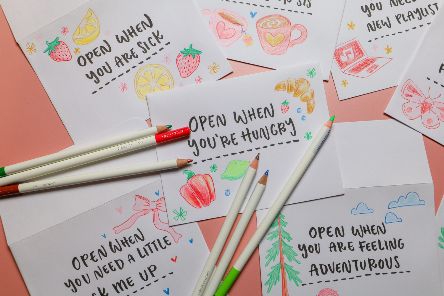 Tombow Irojiten Colored Pencils laying on "Open When" Letters