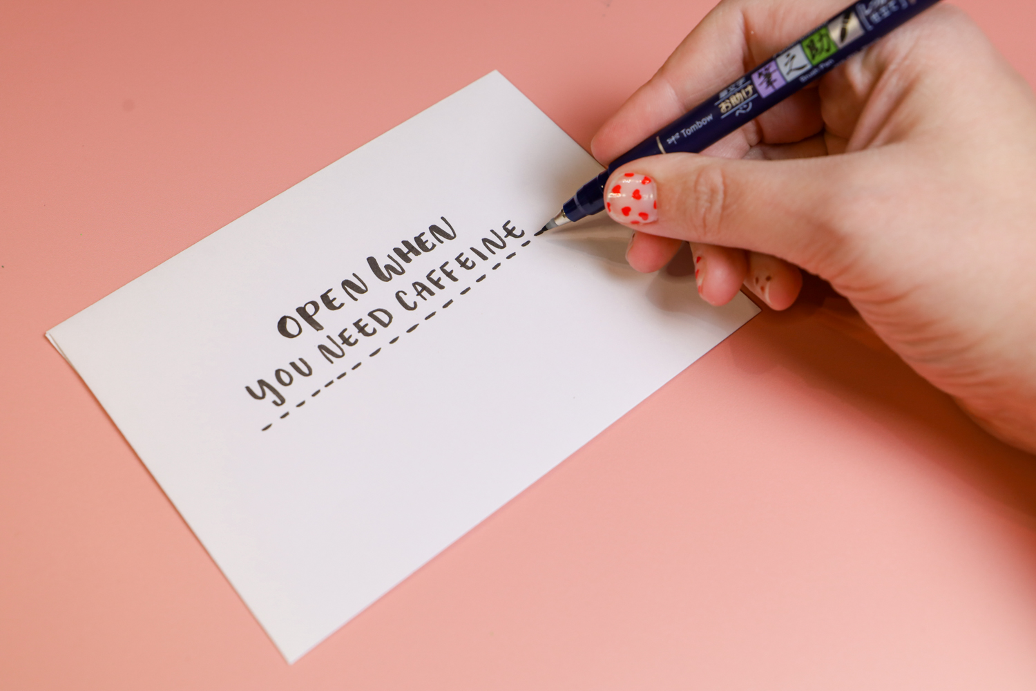 Using Tombow's Fudenosuke Brush Pen to write Open When you need caffeine. 