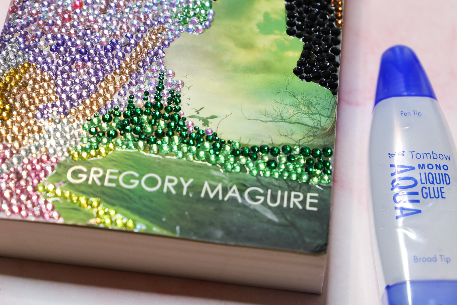 Bedazzling a book by glueing rhinestones to a book cover using Tombow USA adhesive