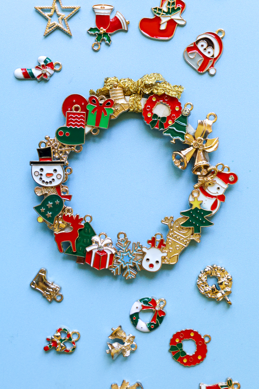 Learn how to make a DIY Christmas Charm Wreath following this tutorial on the @tombowusa Blog using Holiday Charms!