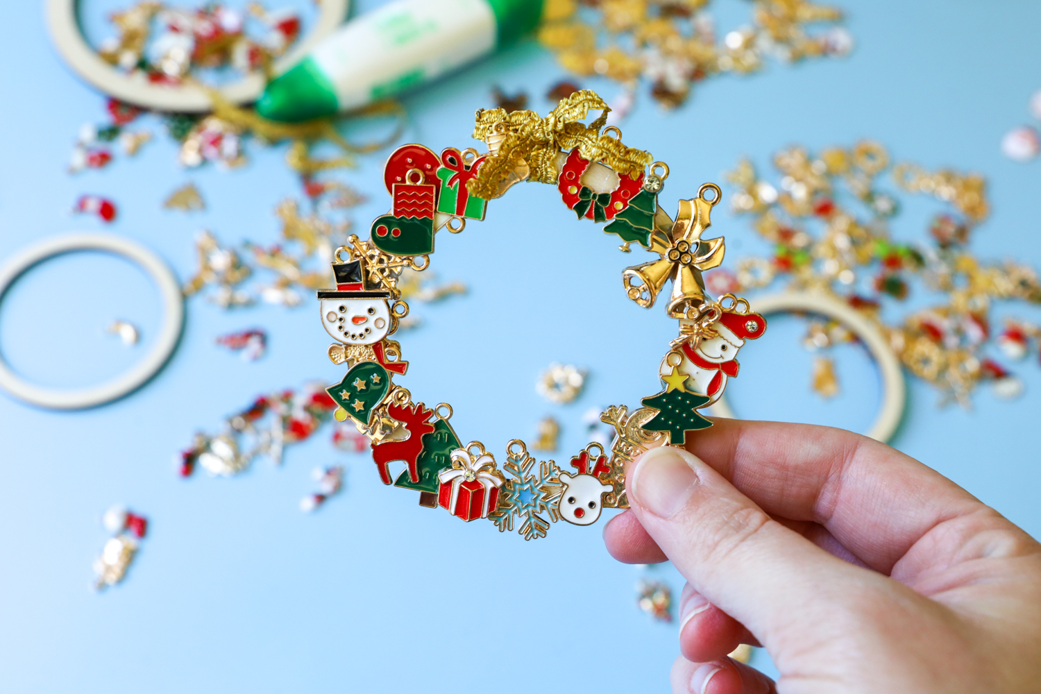 Learn how to make a DIY Christmas Charm Wreath following this tutorial on the Tombow USA Blog using Holiday Charms!