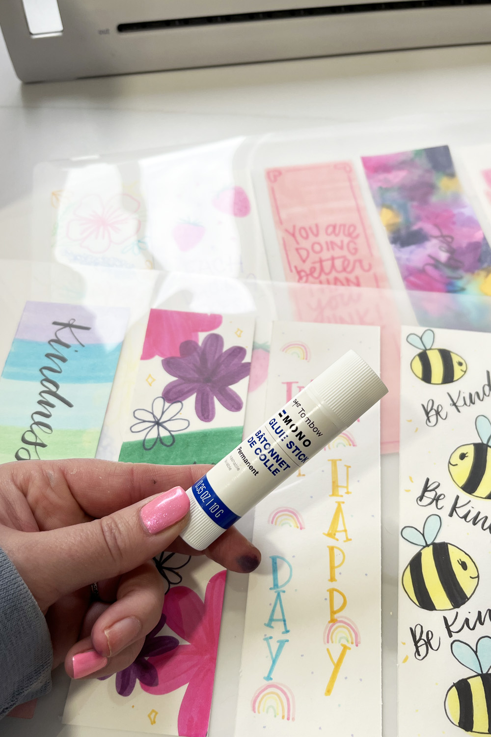Tombow MONO Glue stick being used while laminating