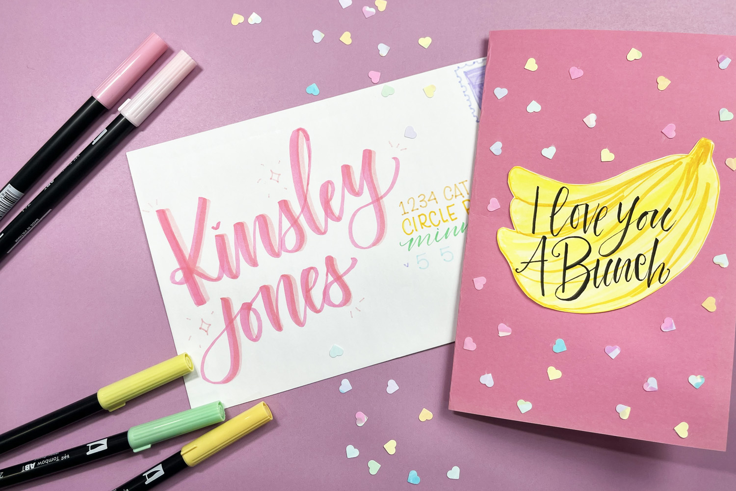 Envelope with hand lettering, banana card and heart confetti