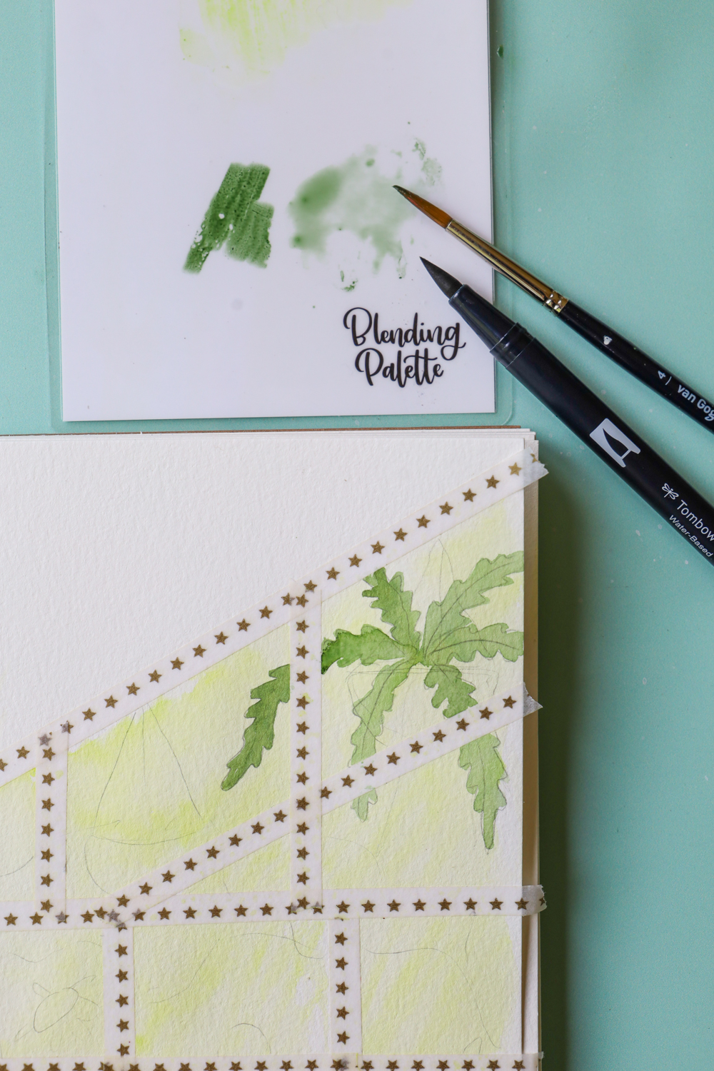 A work in progress painting of a plant hanging in a greenhouse using @tombowusa Dual Brush Pens, Blending Palette, & a paintbrush