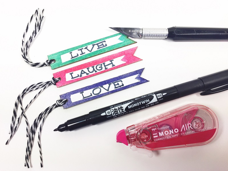 5 Unique techniques using Tombow MONO Air Correction Tape in your Mixed Media Projects including doodles, wood, glass, photo paper and gift bags.