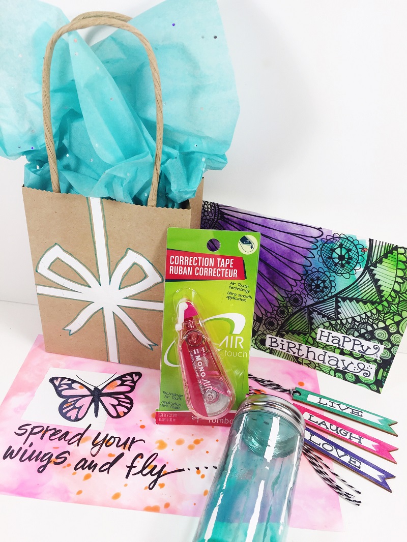 5 Unique techniques using Tombow MONO Air Correction Tape in your Mixed Media Projects including doodles, wood, glass, photo paper and gift bags.