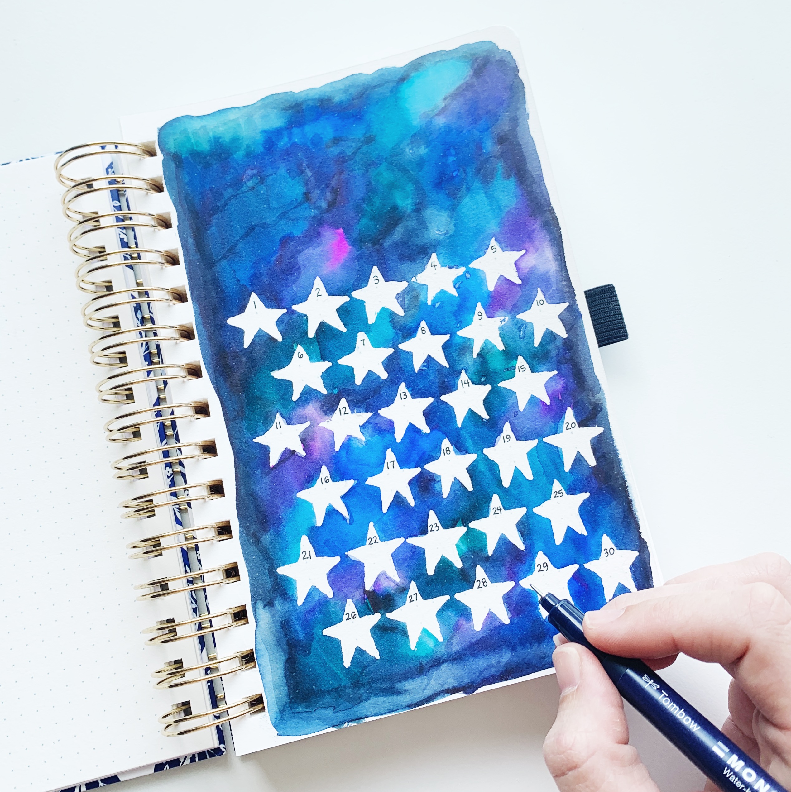 Learn how to make a horoscope watercolor habit tracker with Adrienne from @studio80design!