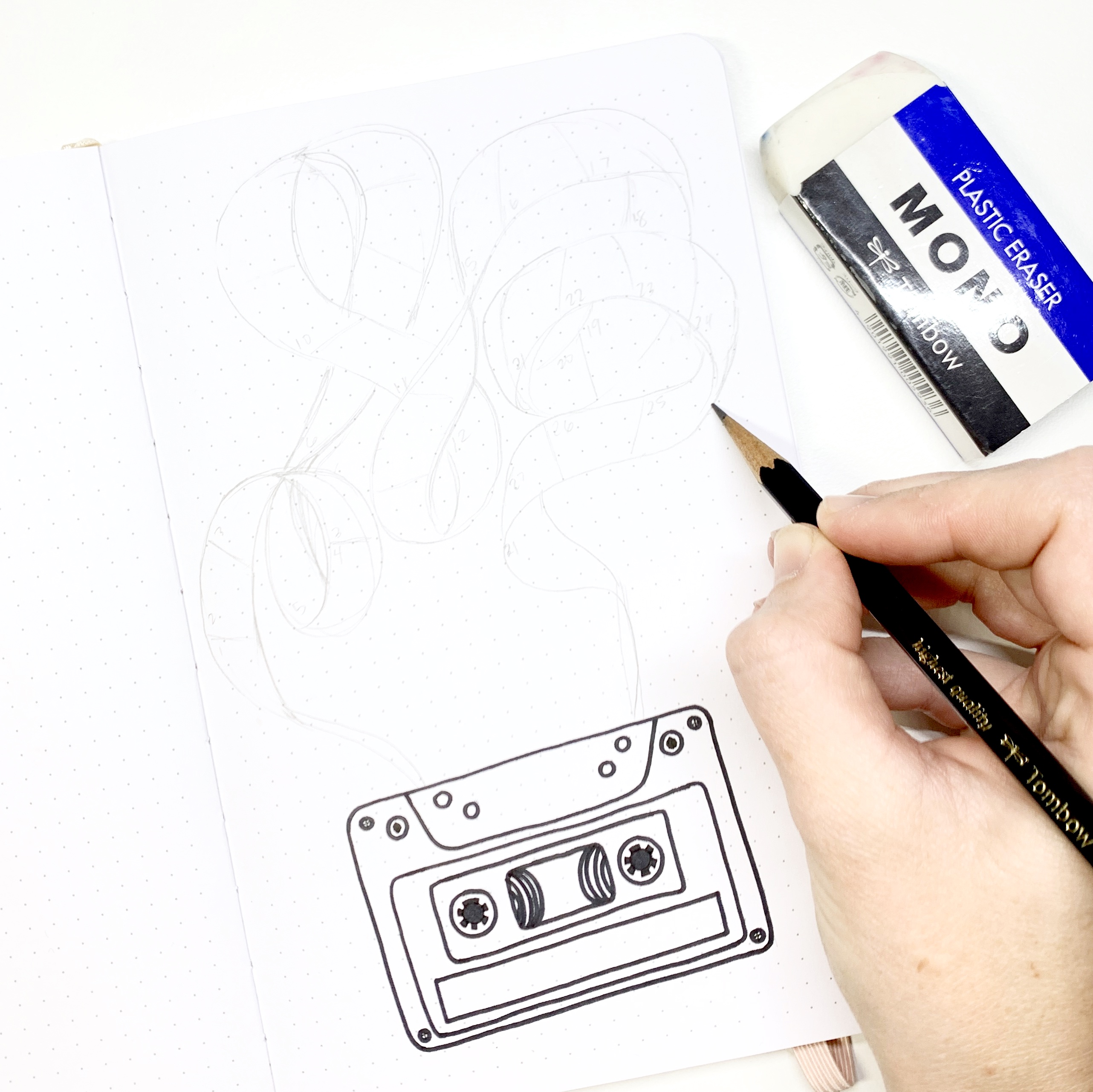 Learn how to create a cassette tape habit tracker in your dot grid notebook with Adrienne from @studio80design!