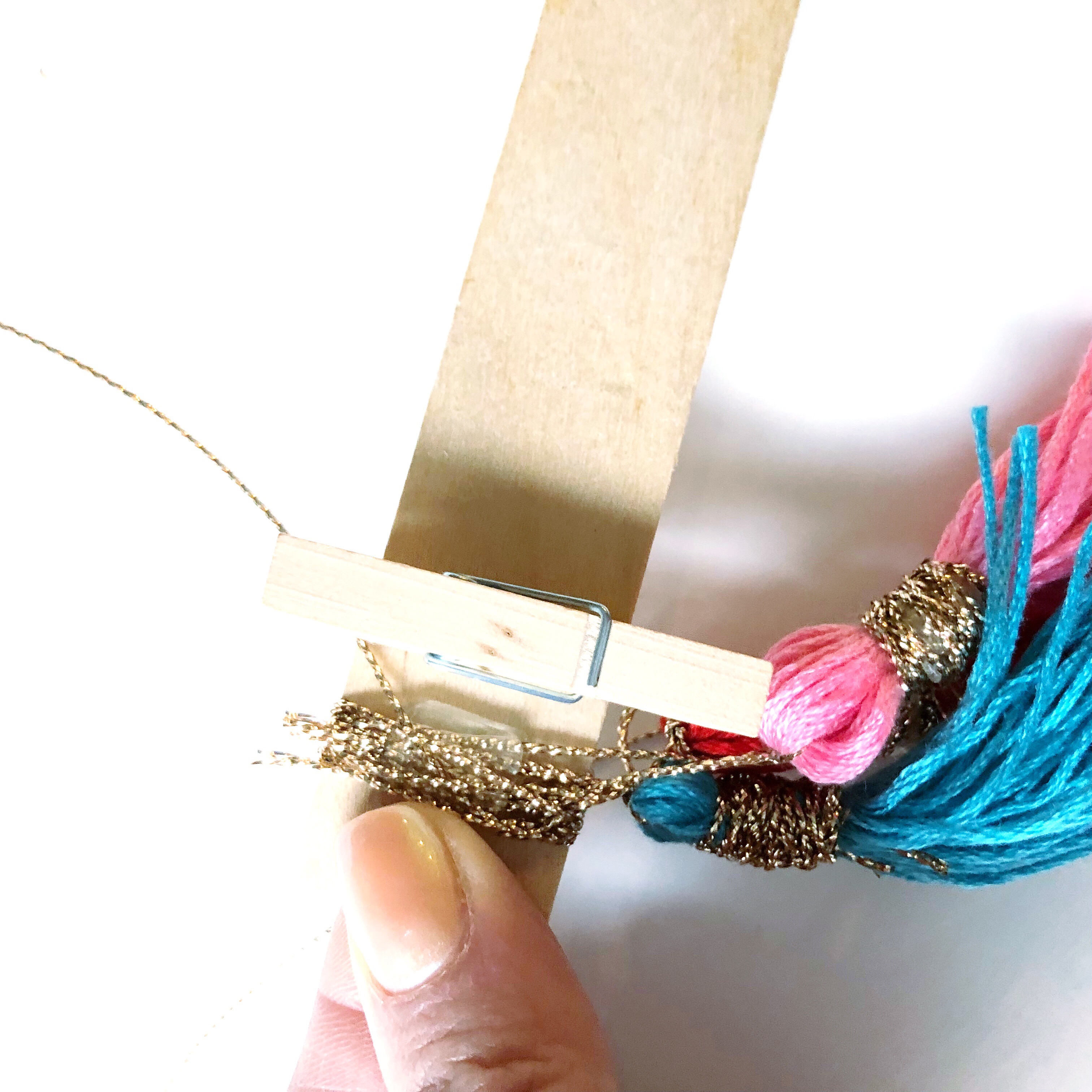 Lauren Fitzmaurice of @renmadecalligraphy shares step by step directions on how to create your own DIY colorful Tassel Quote Holder.