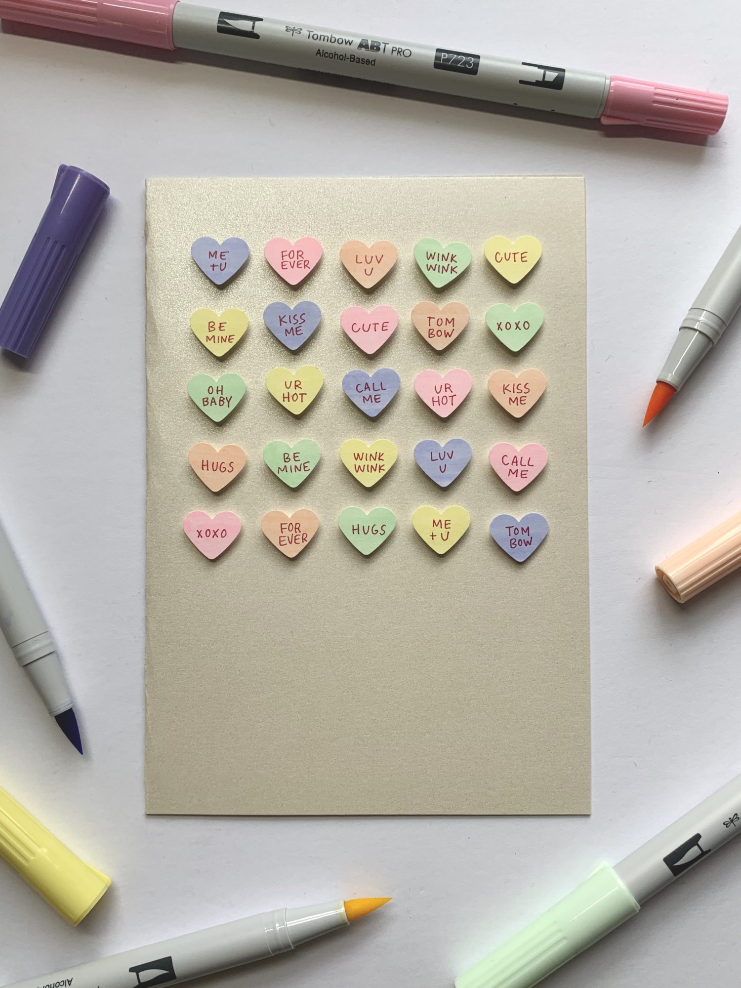 Make this candy heart card using @TombowUSA ABT PRO Alcohol Markers in this tutorial by @LePereLetters. #valentinesdaycraft #galentinesideas #candyhearts