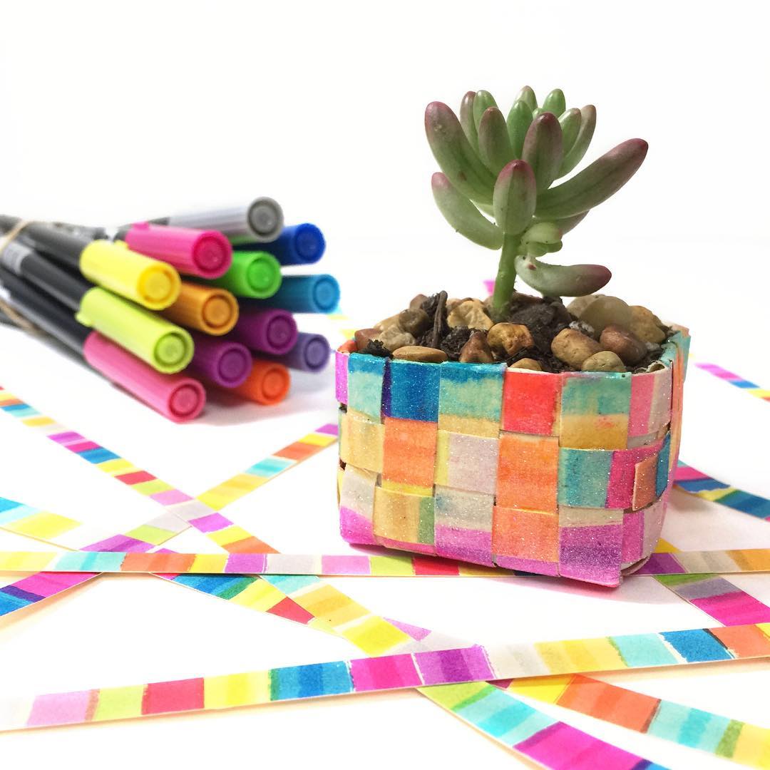 Upcycle an old juicebox lid into a colorful rainbow planter with this tutorial!
