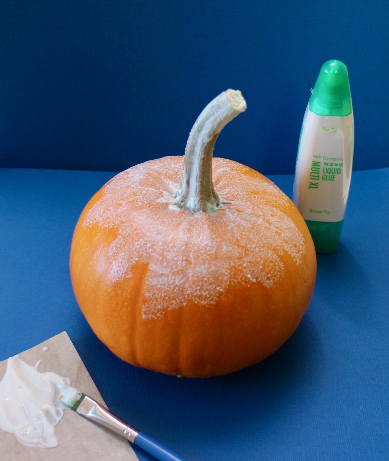 apply the glue to the pumpkin @mariebrowning #tombowusa #falldecor