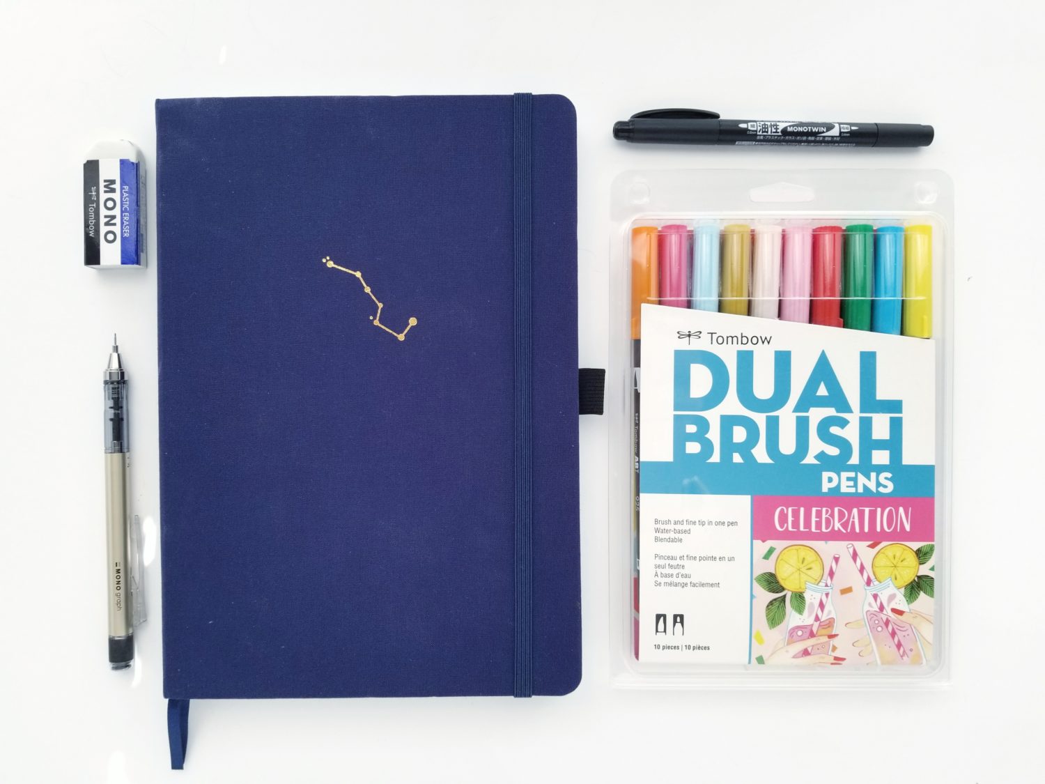 Tombow Brush Pen Testing in 8 Different Bullet Journals – All About Planners