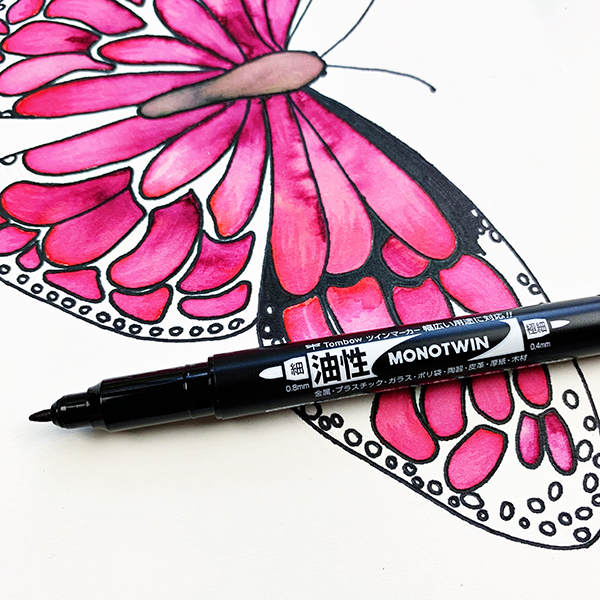 Fill the out the butterfly using the broad tip of the Tombow MONO Twin Permanent Marker. 