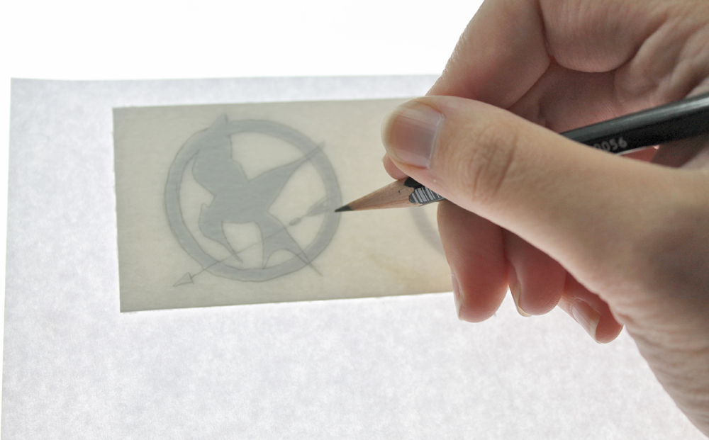 Learn how to make The Hunger Games Heat Embossed Bookmarks using this tutorial by @studiokatie for @TombowUSA