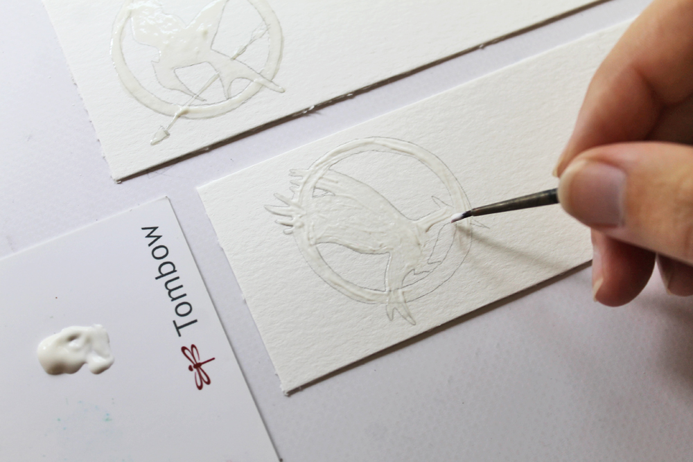 Learn how to make The Hunger Games Heat Embossed Bookmarks using this tutorial by @studiokatie for @TombowUSA