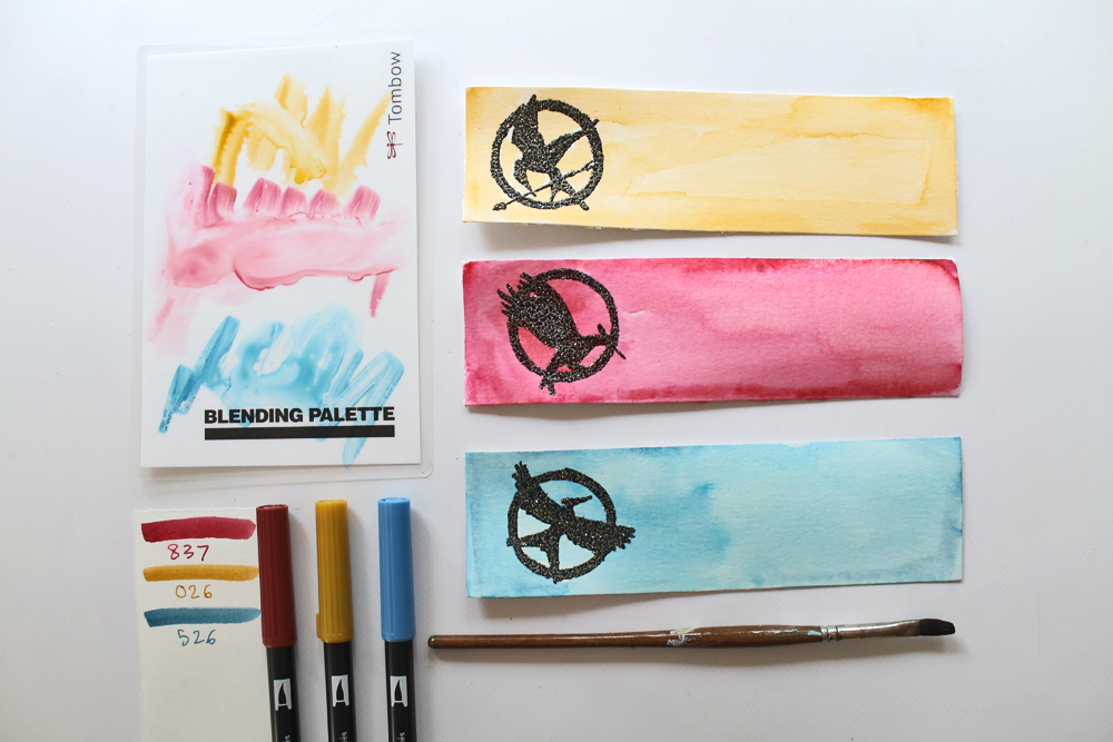 Learn how to make The Hunger Games Heat Embossed Bookmarks using this tutorial by @studiokatie for @TombowUSA