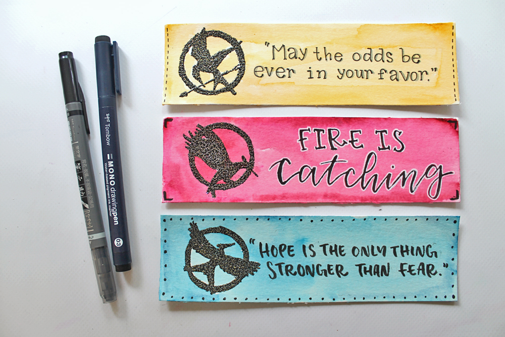 Learn how to make The Hunger Games Heat Embossed Bookmarks using this tutorial by @studiokatie for @TombowUSA