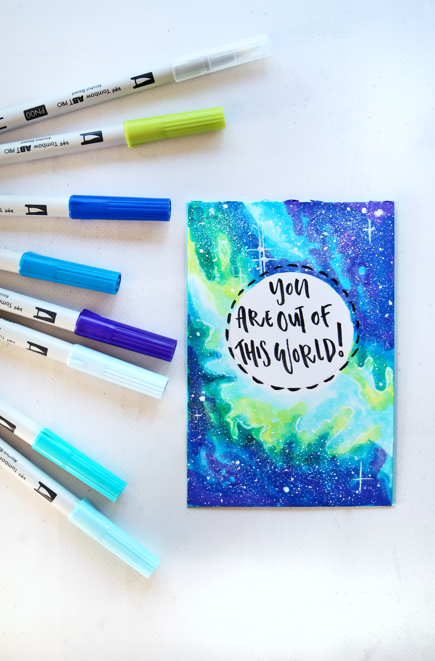 Learn how to color a galaxy using @tombowusa ABT PRO Markers and create your own fun Space card! tutorial by @studiokatie on the #tombowusa blog. #tombow #galaxy #cardmaking