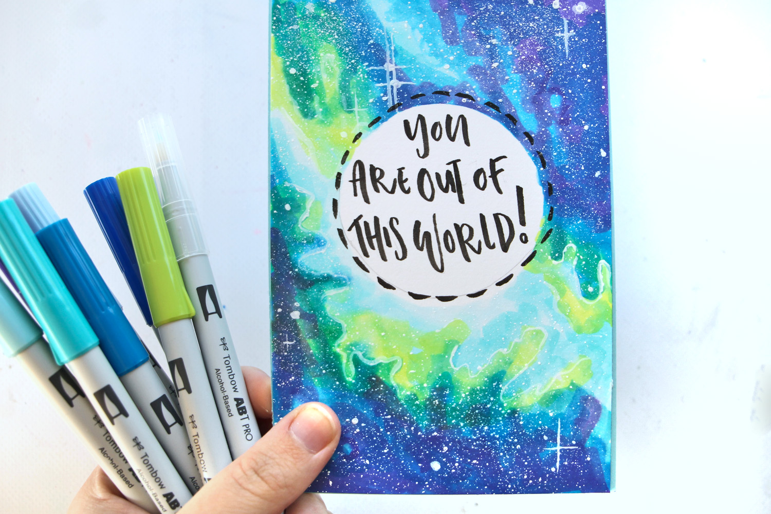 Learn how to color a galaxy using @tombowusa ABT PRO Markers and create your own fun Space card! tutorial by @studiokatie on the #tombowusa blog. #tombow #galaxy #cardmaking